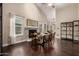 Open dining room with fireplace, modern table, and plenty of natural light at 16014 S 13Th Way, Phoenix, AZ 85048