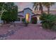 Charming front yard with desert landscaping, including cacti, bushes, and decorative rock at 16014 S 13Th Way, Phoenix, AZ 85048