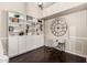 Cozy home office features custom built-ins, dark wood floors, and stylish decor at 16014 S 13Th Way, Phoenix, AZ 85048