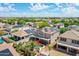 Aerial view showing a neighborhood with solar panels and a home with a backyard pool at 16322 N 171St Dr, Surprise, AZ 85388