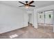 Inviting bedroom featuring carpet, a ceiling fan, a closet, and a window for natural light at 16322 N 171St Dr, Surprise, AZ 85388