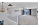 Upstairs bonus room with neutral carpet and a large window providing natural light at 16322 N 171St Dr, Surprise, AZ 85388