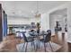 An eat-in kitchen features a round dining table with seating for four and modern pendant lighting above at 16322 N 171St Dr, Surprise, AZ 85388