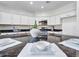 Bright kitchen with granite countertops, stainless steel appliances, and modern white cabinetry at 16322 N 171St Dr, Surprise, AZ 85388