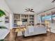 Comfortable living room featuring a built-in shelving, modern furniture, and wood flooring at 16322 N 171St Dr, Surprise, AZ 85388