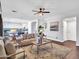 Spacious open-concept living room with wood floors, neutral tones, and modern decor at 16322 N 171St Dr, Surprise, AZ 85388