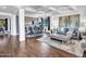 Open-concept living and dining area featuring tile floors and coffered ceilings at 16322 N 171St Dr, Surprise, AZ 85388
