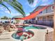 The backyard showcases a pool, spa and waterfall with sunshade offering relaxing retreat at 16322 N 171St Dr, Surprise, AZ 85388