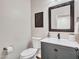 This powder room has neutral walls, decorative accents, a floating vanity, and a framed mirror at 16322 N 171St Dr, Surprise, AZ 85388