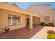 Enjoy the covered back patio with tile flooring, ceiling fan, and view of the desert landscape at 1700 E Lakeside Dr # 64, Gilbert, AZ 85234