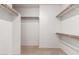 Organized walk-in closet with ample shelving and storage space at 1700 E Lakeside Dr # 64, Gilbert, AZ 85234