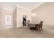 Bright dining room features a chandelier, vaulted ceilings, and doorway to the kitchen at 1700 E Lakeside Dr # 64, Gilbert, AZ 85234
