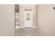 Foyer with light colored tile floors and a glass door leading to the front of the home at 1700 E Lakeside Dr # 64, Gilbert, AZ 85234