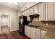 Kitchen with stainless steel appliances, granite countertops and wood-look flooring at 1700 E Lakeside Dr # 64, Gilbert, AZ 85234