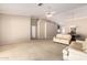 Spacious living room featuring neutral paint, vaulted ceilings, and an open floor plan to the dining area at 1700 E Lakeside Dr # 64, Gilbert, AZ 85234