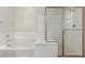 Bright bathroom features a separate tub and glass shower at 17219 W Gibson Ln, Goodyear, AZ 85338