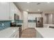 Stylish kitchen with white cabinetry, stainless steel appliances, and decorative backsplash at 17219 W Gibson Ln, Goodyear, AZ 85338