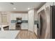 Well-equipped kitchen featuring white cabinets, stainless steel appliances, and ample counter space at 17219 W Gibson Ln, Goodyear, AZ 85338