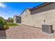 Backyard features artificial turf, desert landscaping and an air conditioning unit at 17279 W Dartmouth St, Surprise, AZ 85388