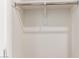 Interior view of closet with rod for hanging clothes, ready for storage at 17279 W Dartmouth St, Surprise, AZ 85388