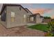 Exterior backyard showcasing the home's architecture, desert landscaping and yard at 17279 W Dartmouth St, Surprise, AZ 85388