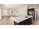 Spacious open-concept kitchen, showcasing an island overlooking the living area at 17279 W Dartmouth St, Surprise, AZ 85388