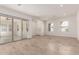 Open-concept living area with sliding glass doors and stylish, light-colored flooring at 17279 W Dartmouth St, Surprise, AZ 85388