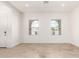 Bright, airy room with wood floors, neutral walls, and lots of natural light at 17279 W Dartmouth St, Surprise, AZ 85388