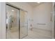Bathroom featuring a soaking tub with sliding glass doors, next to the shower at 17371 N Natura Trl, Surprise, AZ 85374