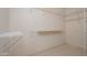 Walk-in closet featuring adjustable shelving units offering ample storage space at 17371 N Natura Trl, Surprise, AZ 85374
