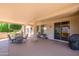 Large covered patio with plenty of space for outdoor seating, dining, and entertaining at 17371 N Natura Trl, Surprise, AZ 85374