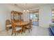Dining room with a wooden table set and sliding doors leading to an outdoor patio at 17371 N Natura Trl, Surprise, AZ 85374