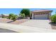 Beautiful single-story home with a two-car garage and easy to maintain desert landscaping at 17371 N Natura Trl, Surprise, AZ 85374