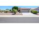 Charming single-story home with a two-car garage and attractive desert landscaping for easy care at 17371 N Natura Trl, Surprise, AZ 85374