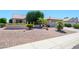 Inviting single-story home with a two-car garage and easy to maintain desert landscaping at 17371 N Natura Trl, Surprise, AZ 85374