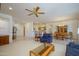 Spacious living room with an open floor plan connected to the dining area and kitchen at 17371 N Natura Trl, Surprise, AZ 85374