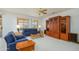 Bright living room with natural light, with comfortable seating and elegant wood built-ins at 17371 N Natura Trl, Surprise, AZ 85374