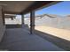 Spacious backyard showcasing covered patio and block fencing, perfect for outdoor living at 17482 W Fulton St, Goodyear, AZ 85338