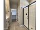 Bright bathroom showcasing a walk-in shower and vanity with modern fixtures at 17482 W Fulton St, Goodyear, AZ 85338