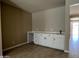 Versatile space with built-in cabinets and countertop, ideal for a home office, study, or entertainment area at 17482 W Fulton St, Goodyear, AZ 85338
