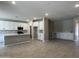 Spacious open-concept kitchen featuring a center island, modern appliances, and ample cabinet space at 17482 W Fulton St, Goodyear, AZ 85338