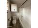 Functional bathroom with a standard bathtub and essential fixtures, ideal for renovation at 1807 W Hazelwood St, Phoenix, AZ 85015