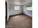 Bright bedroom with neutral walls and carpet, creating a comfortable retreat at 1807 W Hazelwood St, Phoenix, AZ 85015