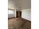 Bedroom with decorative wallpaper, offering plenty of space and natural light at 1807 W Hazelwood St, Phoenix, AZ 85015