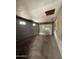 This is a view of an empty attached garage with concrete floor and block walls at 1807 W Hazelwood St, Phoenix, AZ 85015