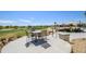 Outdoor patio with dining set and golf course views, perfect for entertaining or relaxing at 19541 N Rim Dr, Surprise, AZ 85374