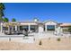 Charming backyard patio features a comfortable seating area, perfect for enjoying the serene outdoor space at 19541 N Rim Dr, Surprise, AZ 85374