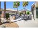 Cozy backyard patio featuring an outdoor kitchen and dining area, perfect for summer BBQs and Gathering gatherings at 19541 N Rim Dr, Surprise, AZ 85374