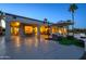 Expansive backyard features a covered patio, seating areas, and views of the surrounding landscape at 19541 N Rim Dr, Surprise, AZ 85374