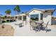 Beautiful backyard patio with sleek furniture, offering stunning views of the golf course, perfect for outdoor living at 19541 N Rim Dr, Surprise, AZ 85374